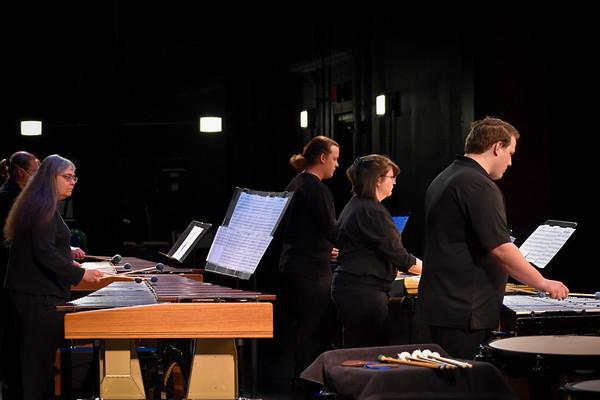 A group of music students and Professor Jackson playing a xylophone